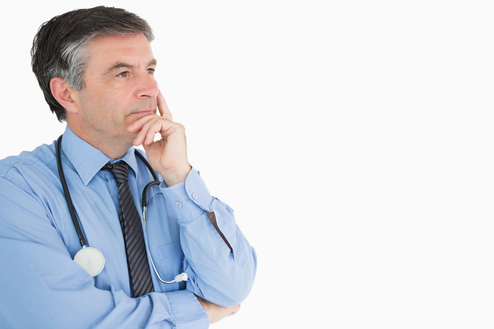 Doctor in shirt and tie deep in thought