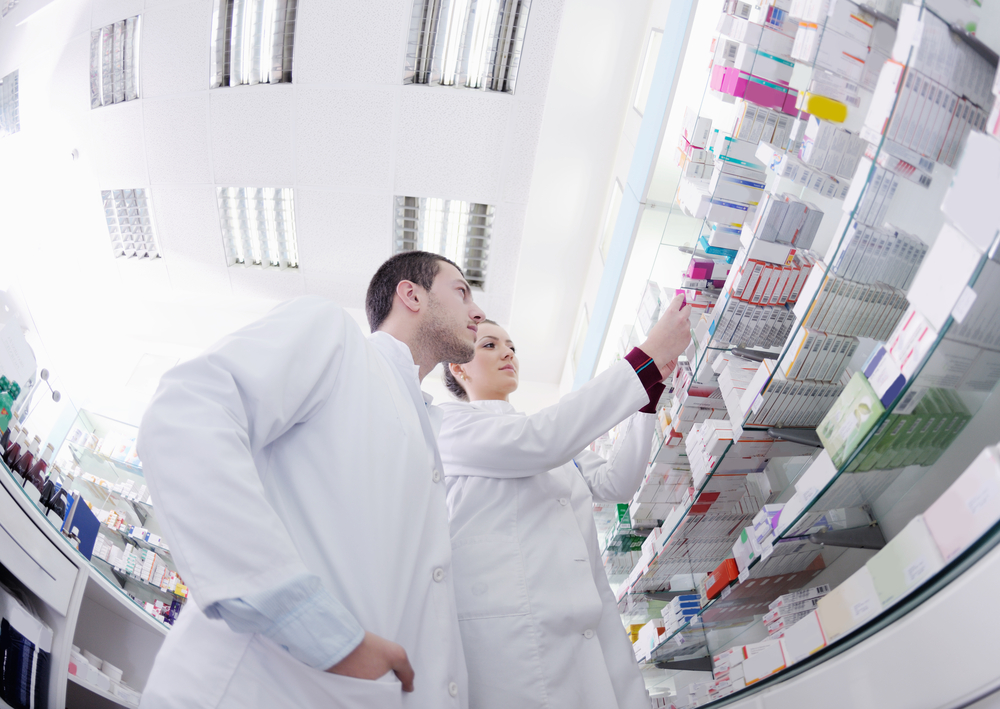 team of  pharmacist chemist woman and man  group  standing in pharmacy drugstore-1