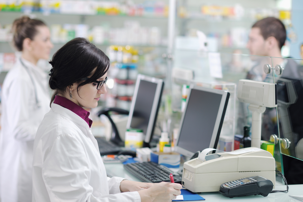 young pharmacist suggesting medical drug to buyer in pharmacy drugstore-3